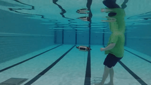 A GIF showing the Aqua robot beckoning for the diver to follow it.